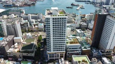 White High-rise Apartment by Harbor